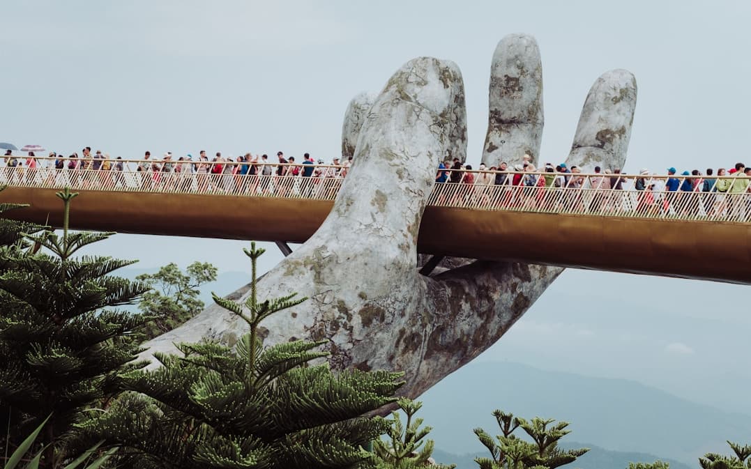 The Golden Bridge held up by stone hands