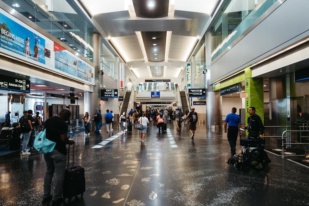 Travellers walking through an airport terminal